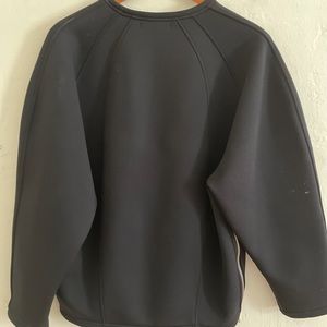 Ziosongzio Black wet suit material sweatshirt. Small fits medium oversized.